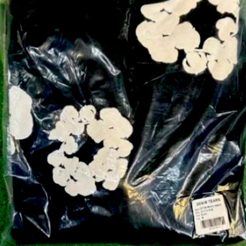 Denim Tears Black Hoodie with White Floral Design
